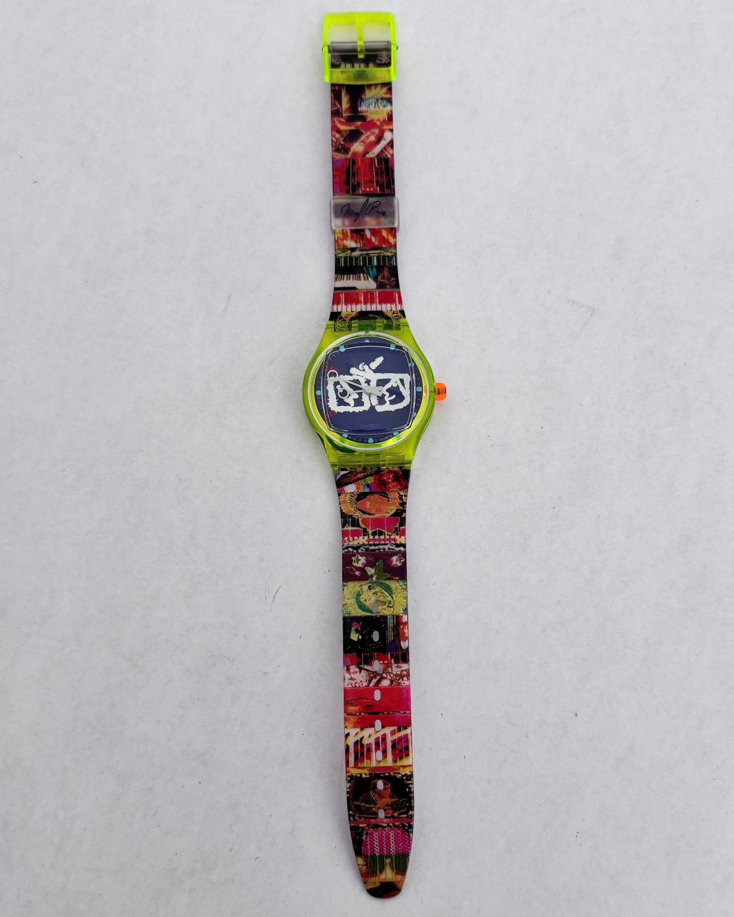 Colorful watch with a patterned strap on a light gray background