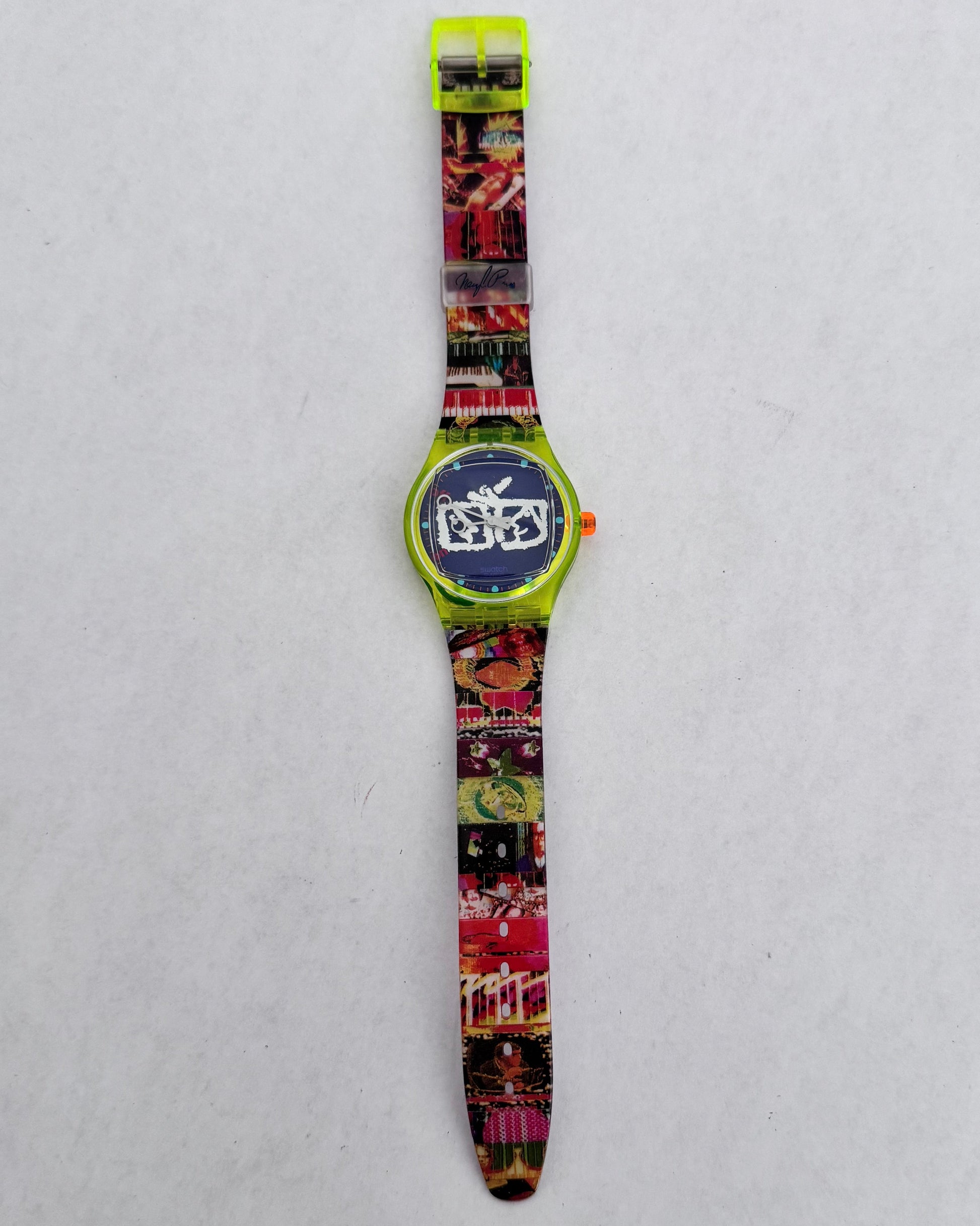 Colorful watch with a patterned strap on a light gray background